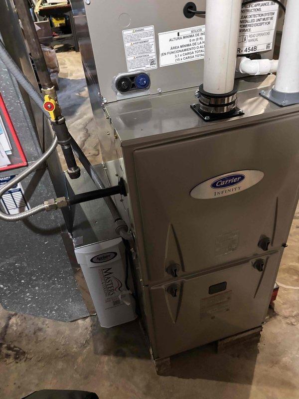 Completed scheduled prepaid heating maintenance on Carrier Infinity furnace system. Performed comprehensive system inspection, measured gas pressure at 122" w.c. using dual port manometer, verified proper operation of all components including control board and safety switches. System operating within manufacturer specifications with no deficiencies noted.