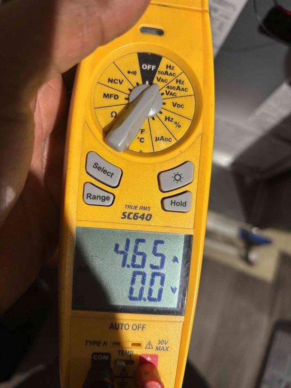 Completed scheduled heating maintenance on residential HVAC system. Inspected and verified operation of HALO-CONNECT air purification system with RE85E air purifier and dual BLUE-QII UV units, confirming all status displays and indicator lights functioning properly. Performed electrical diagnostics using digital multimeter, recording voltage readings of 465V to verify proper system operation and electrical integrity.