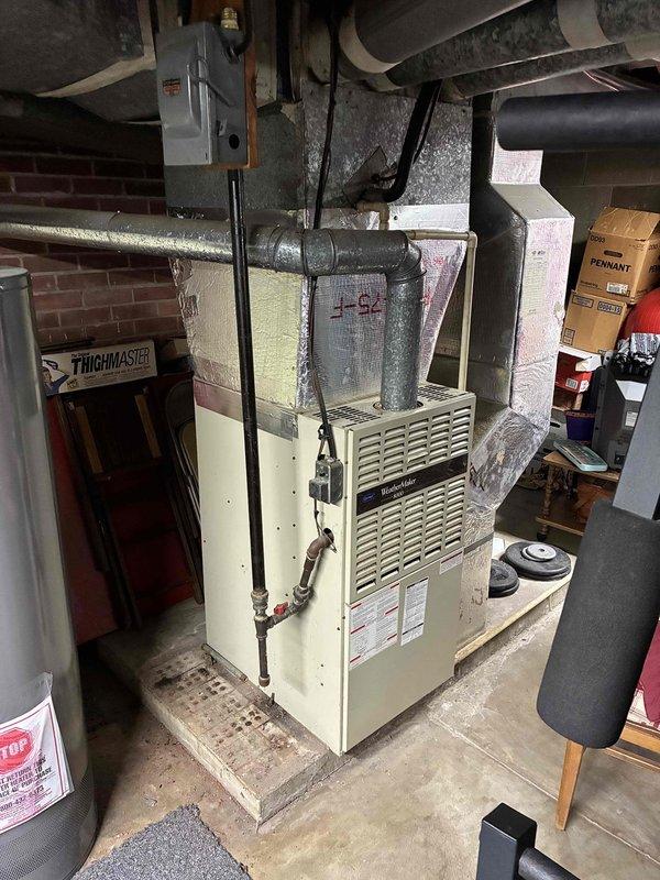 Completed full system estimate for HVAC replacement at residential property. Existing outdoor condenser unit shows significant rust corrosion on upper housing with visible streaking and deterioration from extended weather exposure. Indoor furnace located in basement with standard ductwork configuration. Customer was referred for complete system replacement evaluation, and comprehensive assessment of both heating and cooling equipment was provided with replacement recommendations.