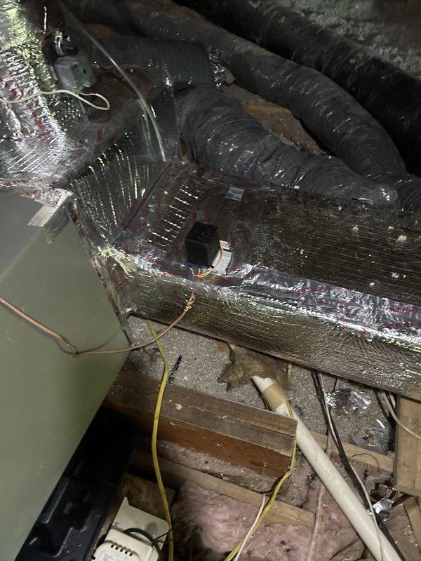 Completed installation of Carrier 59TP7A100V21--20 Performance 97 Series two-stage gas furnace with 100,000 BTU heating capacity in attic space, replacing existing 90% efficiency unit. Reconfigured and installed new ductwork with zoning system, insulated flue and drain lines, installed electrical junction boxes and conduit, and properly routed all PVC condensate drainage. All components installed per manufacturer specifications with AHRI matchup certification 215722132/216012690, achieving 16.5 SEER2 and HSPF2 rating of 8.