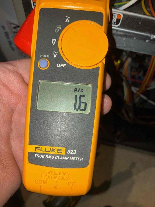 Performed first-visit heating system maintenance, inspecting the equipment cabinet and internal wiring with no visible frost, rust, or damage noted. Used a true RMS clamp meter to verify AC amperage draw (1.6 A) and a digital multimeter to measure component resistance (48.2 Ω), confirming electrical components were operating within normal parameters.