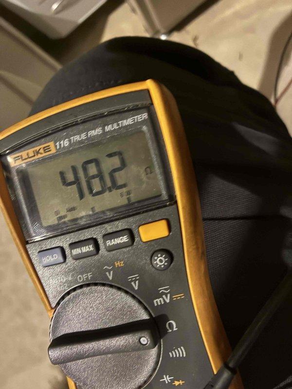 Performed first-visit heating system maintenance, inspecting the equipment cabinet and internal wiring with no visible frost, rust, or damage noted. Used a true RMS clamp meter to verify AC amperage draw (1.6 A) and a digital multimeter to measure component resistance (48.2 Ω), confirming electrical components were operating within normal parameters.