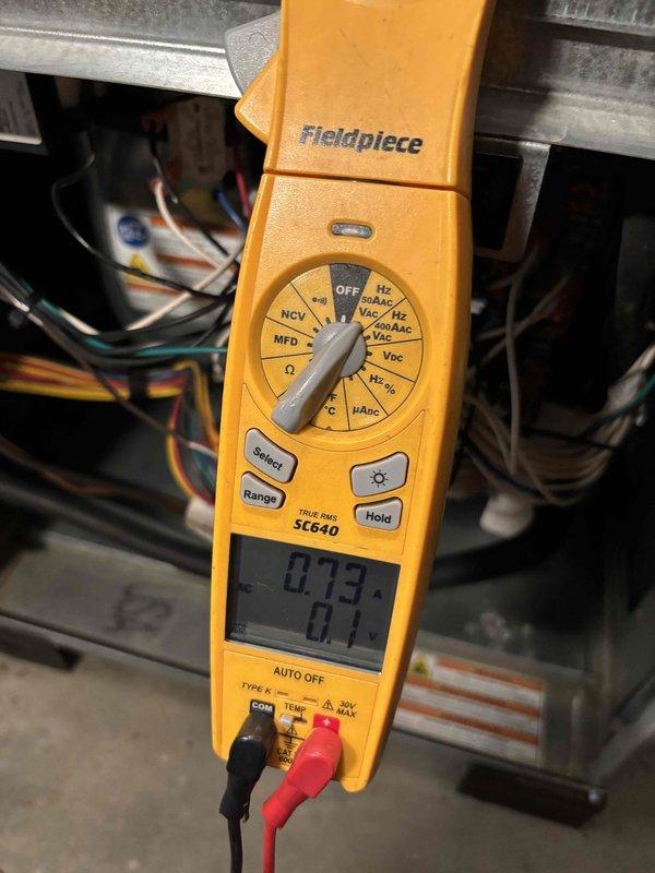 Performed scheduled preventive maintenance on the geothermal heat pump system, including electrical diagnostics with a True RMS clamp meter to measure amperage draw and verify proper operation of the equipment's control and power wiring. Inspected the interior cabinet, wiring harnesses, burner and gas valve assembly, and surrounding components for signs of frost, corrosion, or damage, finding none, and confirmed the system was operating normally at the conclusion of the visit.