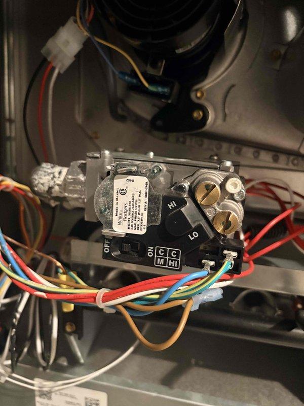 Responded to a no-heat call on a newly installed gas furnace. Inspected the gas valve assembly and wiring harness, confirming secure terminal connections and proper valve operation. Verified ignition sequence and burner operation, with stable blue flame observed across all burners and normal flame visibility at the sight glass. System restored to normal heating operation with no further issues found.