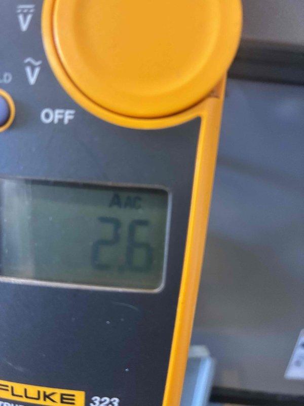 Performed seasonal heating system maintenance and electrical diagnostics, using a true-RMS multimeter to verify component resistance (46.5 Ω reading) and a clamp meter to measure operating amperage draw (2.6 A AC) on the unit. Electrical readings were documented to confirm components are operating within normal parameters and the system is ready for the heating season.