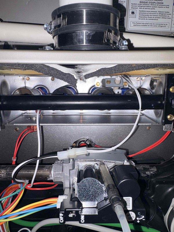Replaced the furnace control board, inducer assembly, and gas valve to restore proper ignition and combustion operation. Verified gas manifold pressure with a dual-port manometer after installation and confirmed the unit is operating within specification. Noted deteriorated burner compartment insulation and minor surface rust near the burner and gas valve area for future monitoring.