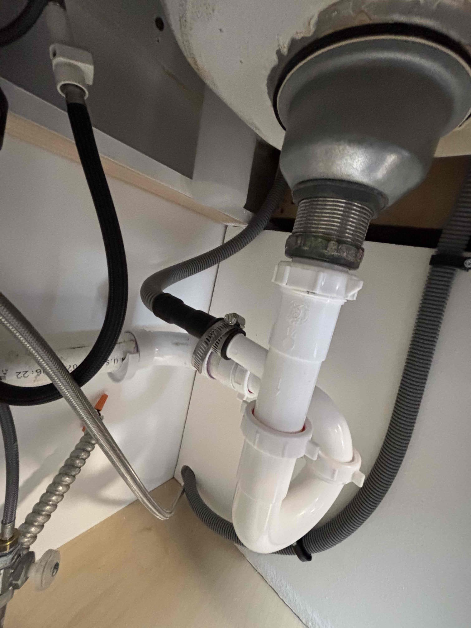 Installed dishwasher, customer supplied water supply line, had to extend discharge hose to reach under sink cabinet. Tested everything and no leaks. 