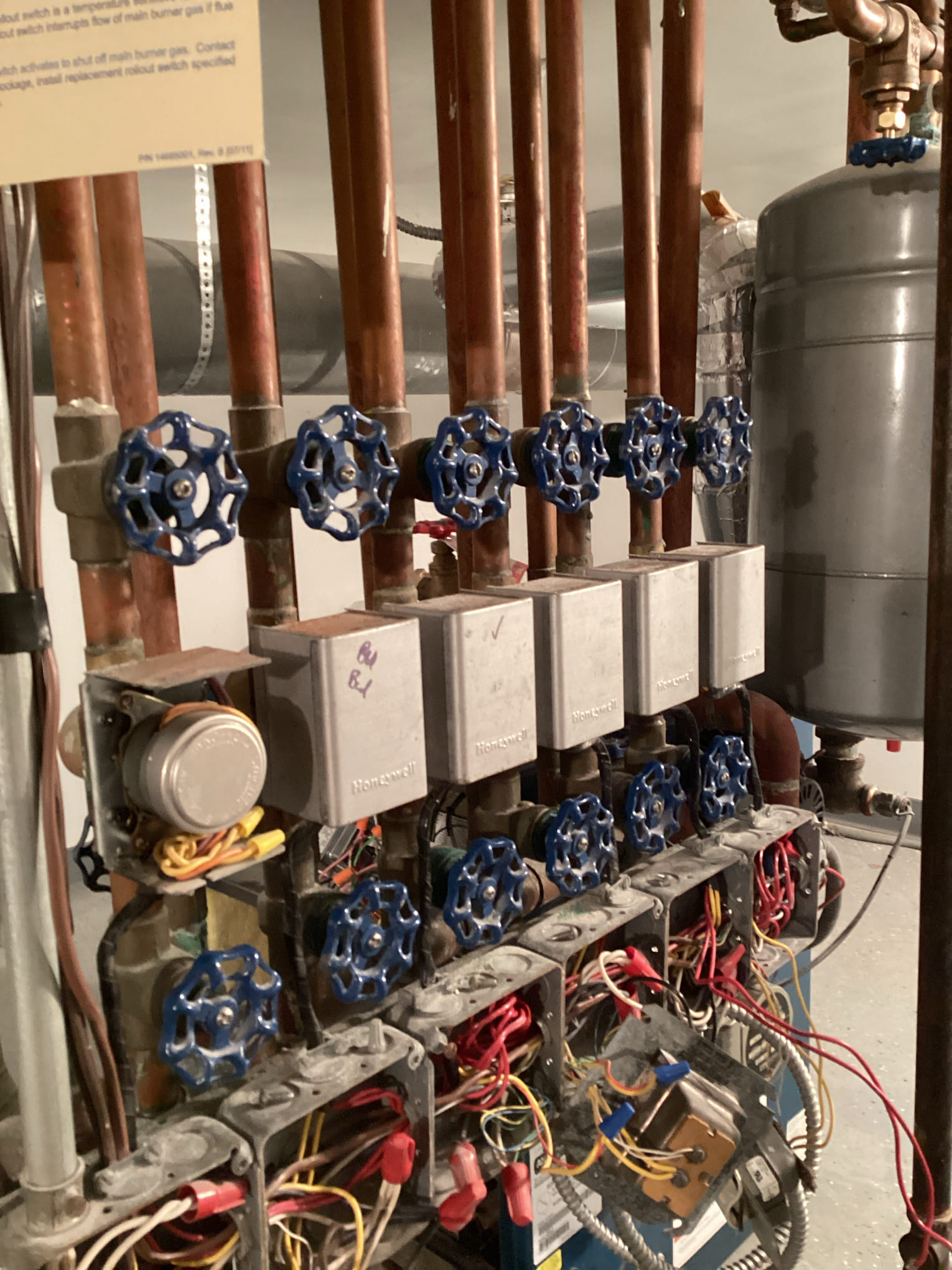 The inducer was continuously running. I found the gas valve was not opening and the boiler was not heating. I replaced the gas valve and set up for l.p. operation. The boiler is working properly. 
2 zone valves have the end switches disconnected and 1 other has a bad motor. The homeowner uses the boiler as back up heat only and is not concerned with the zone valves at this time