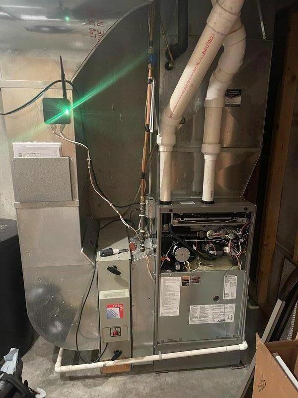 Performed Family Rewards Tune-Up on 2-year-old heating system. Service included cleaning flame sensor, inspecting condensate system, and verifying proper operation of main furnace and electric boilers for basement and garage floor heating systems. Garage floor heating could not be activated due to warm ambient temperature limiting thermostat range, though system appears functional.