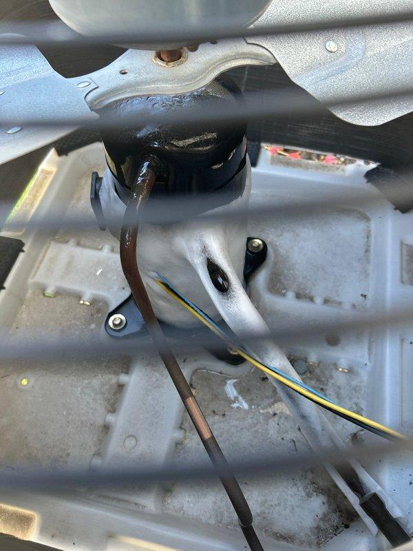 Responded to service call for AC leaking water. Upon inspection, found system completely iced over due to severely clogged air filter. Disconnected power at safety switch, removed and replaced dirty filter, and allowed unit to defrost. Customer advised that follow-up visit will be required to properly check refrigerant levels once system has fully thawed.