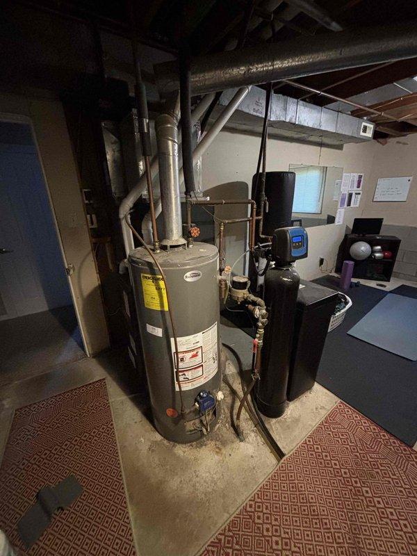 Responded to service call for a 13-year-old Richmond water heater with no hot water. Diagnosed faulty gas valve preventing pilot light from staying lit. Replaced entire water heater unit as repair was not economical due to age of equipment.