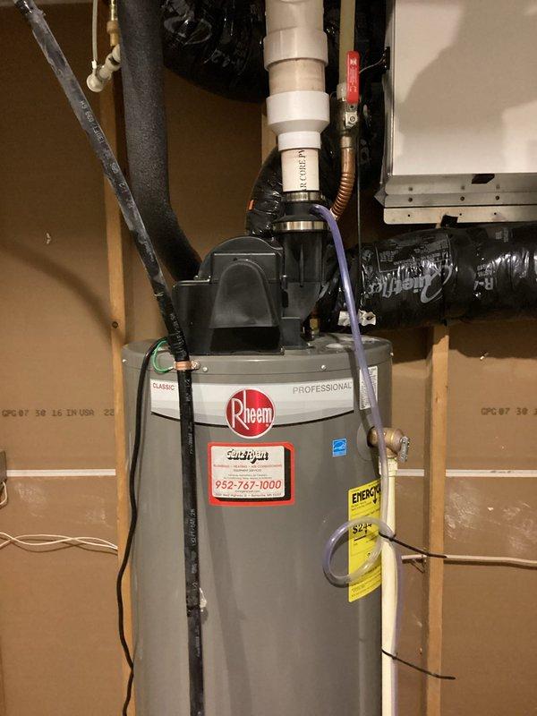 Responded to customer complaint of sulfur odor from hot water system. Inspected Rheem water heater and diagnosed issue as deteriorated anode rod. Performed service including anode rod replacement and complete tank flush to eliminate odor-causing bacteria. Evaluated existing water softener which was experiencing frequent salt bridging issues; recommended replacement with cabinet-style unit including sediment filter to prevent future mineral buildup in water heater. Customer opted for water heater maintenance now with water softener installation to follow.