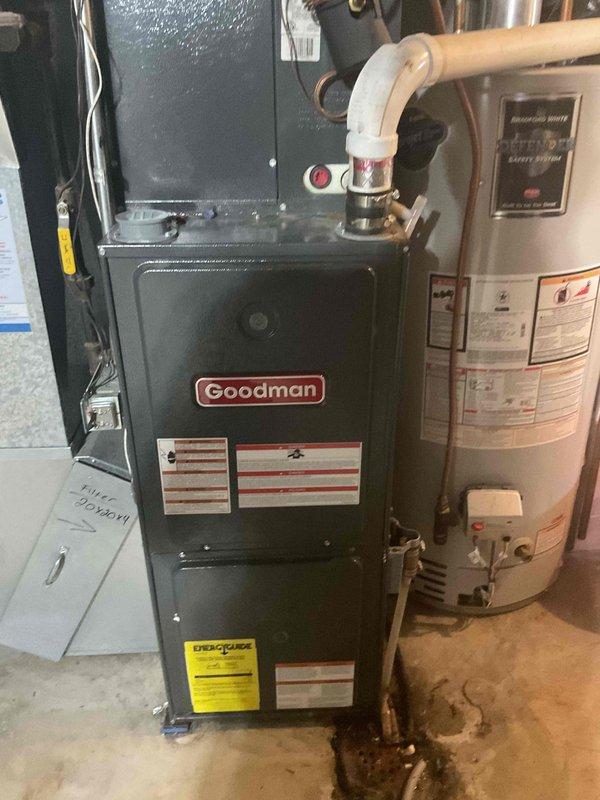 Responded to gas odor complaint in residence. Diagnostic testing revealed minor gas leak at valve adjustment ports. Replaced faulty gas valve on Goodman furnace to eliminate leak hazard and restore safe system operation.