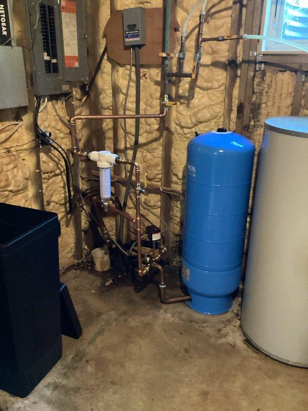 Installed new 32 gallon pressure tank in utility room along with complete system upgrade including new tank tee, pressure switch, pressure gauge, and whole house sediment filter. Removed existing filter system and incorporated membership as specified in the sold repair agreement.