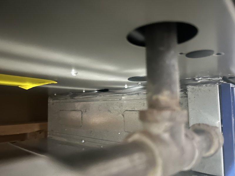 Performed warranty service to address installation deficiencies on recently installed Lennox furnace system. Sealed excessive gap between filter housing and furnace with silicone caulking and tape to prevent seepage into blower compartment. Additionally, applied sealing compounds to drain pan to eliminate air bypass and installed foil tape at identified air leakage points to ensure proper system operation and efficiency.