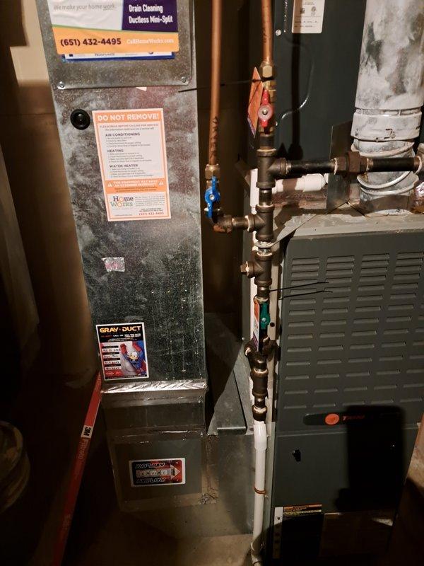 Performed routine tune-up on 23-year-old furnace system and identified critical safety issue with cracked heat exchanger. Due to age of unit and safety concerns, heat exchanger was replaced. System is now operational with proper connections between components verified and all safety protocols followed.