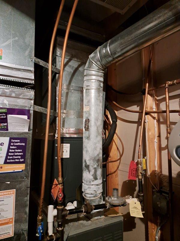 Performed routine tune-up on 23-year-old furnace system and identified critical safety issue with cracked heat exchanger. Due to age of unit and safety concerns, heat exchanger was replaced. System is now operational with proper connections between components verified and all safety protocols followed.
