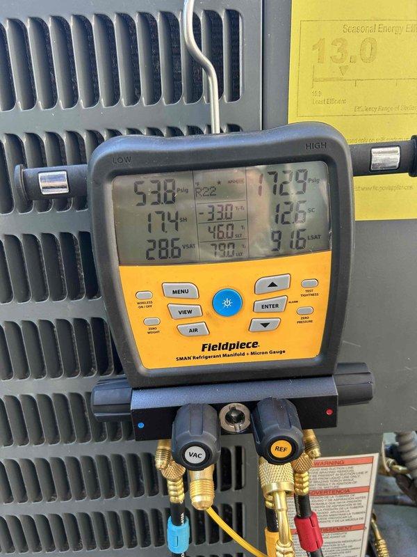Performed scheduled maintenance tune-up on a 12-year-old Goodman R22 air conditioning system. Diagnostic testing showed proper system operation with normal operating pressures and temperatures. Customer initially identified incorrect unit before locating the proper Goodman system which was functioning without issues after inspection and service.