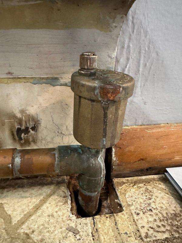 Diagnosed and replaced multiple leaking auto air vent valves on radiator system. Found stripped threads on a bleeder valve that was actively leaking. Customer was present during service as they were installing flooring.