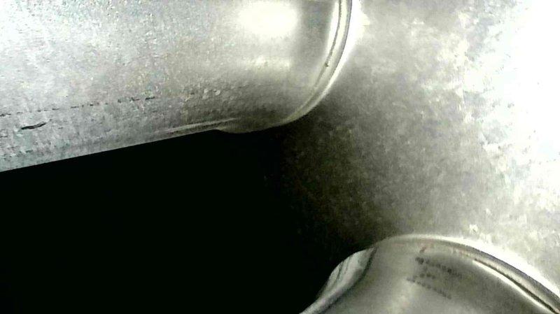 Performed scheduled furnace tune-up on 9-year-old unit per maintenance agreement. Replaced dirty filter (customer-supplied), cleaned condensate system, and removed soot buildup from burners that initially prevented proper ignition. Noted significant burner corrosion and concerning areas on heat exchanger first bends, though no visible cracks were detected. After service, furnace operated properly with correct temperature rise, but recommended heat exchanger replacement evaluation and system upgrade pricing due to orange flame appearance and soot accumulation in exhaust.