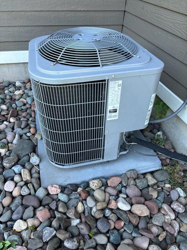 Diagnosed and resolved no cooling issue on a 5-year-old Carrier A/C unit. System had fan operation but no compressor function due to an out-of-specification capacitor. Replaced capacitor, restoring proper cooling function with amperage readings within normal parameters.