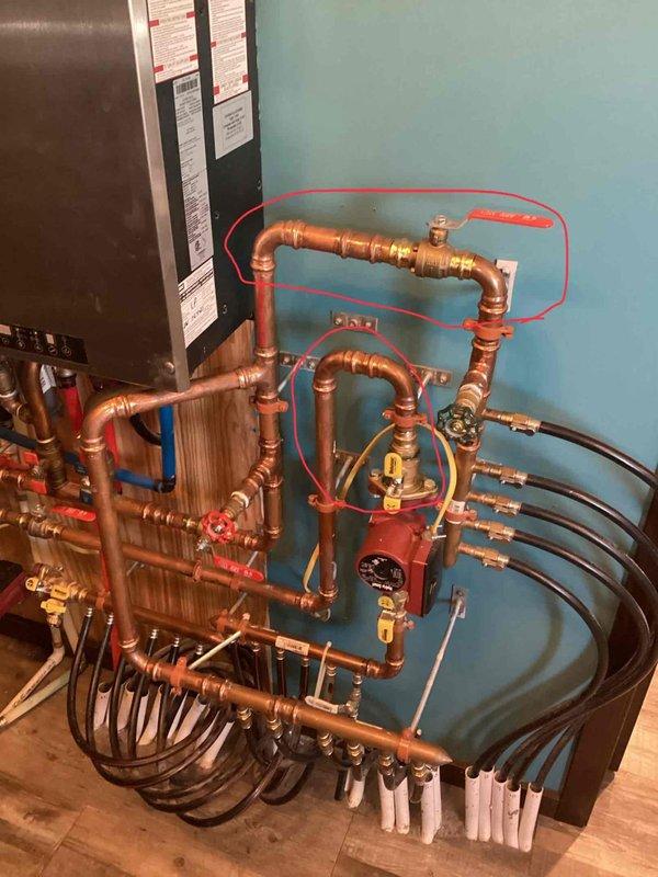 Responded to low pressure code on IBC boiler system. Determined autofill valve was turned off and pressure setting was too low. Restored proper operation by opening valves and adjusting autofill pressure. Noted minor leak issues at ball valve and pump flange connection requiring future attention.