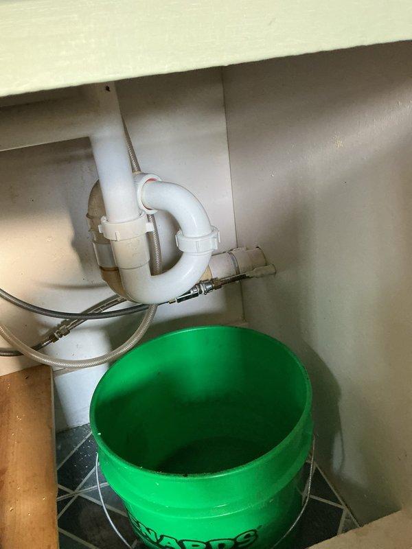 Cleared kitchen sink drain clog approximately 6 feet into the wall using an auger. Clog appeared to be grease-related, causing extremely slow drainage. Advised tenant on preventative maintenance to run hot water after washing dishes to minimize future grease buildup.