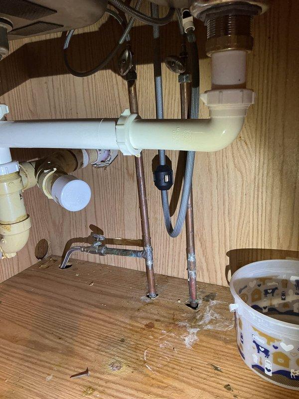 Successfully cut and capped water supply lines in kitchen during ongoing renovation. Removed existing plumbing connections and installed appropriate caps on water lines to ensure no leakage while maintaining proper drainage system functionality.
