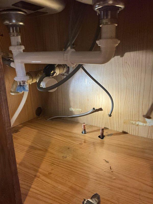 Successfully cut and capped water supply lines in kitchen during ongoing renovation. Removed existing plumbing connections and installed appropriate caps on water lines to ensure no leakage while maintaining proper drainage system functionality.