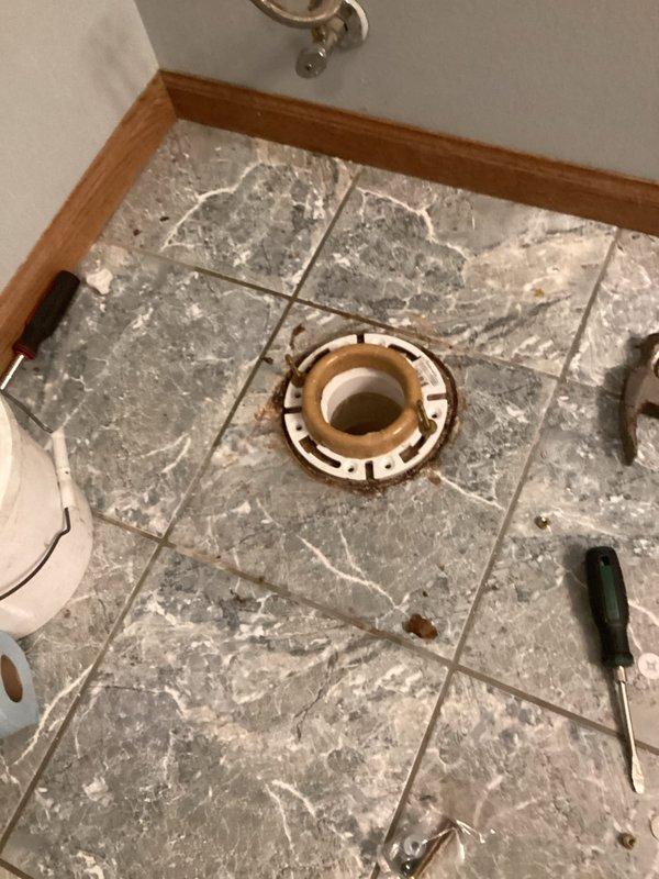 Removed failing toilet causing high water bills due to aged gaskets. Discovered broken closet flange during removal; performed complete replacement of closet flange and PVC incement floor. Installed customer-supplied toilet with two rear shims for proper leveling.