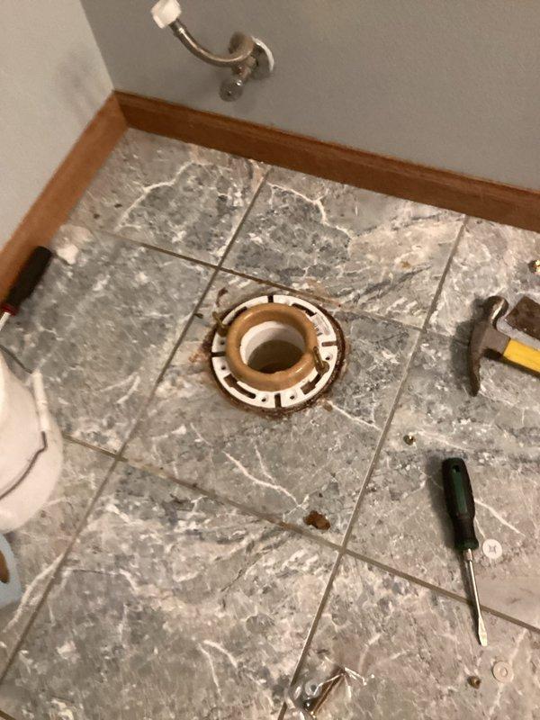 Removed failing toilet causing high water bills due to aged gaskets. Discovered broken closet flange during removal; performed complete replacement of closet flange and PVC incement floor. Installed customer-supplied toilet with two rear shims for proper leveling.