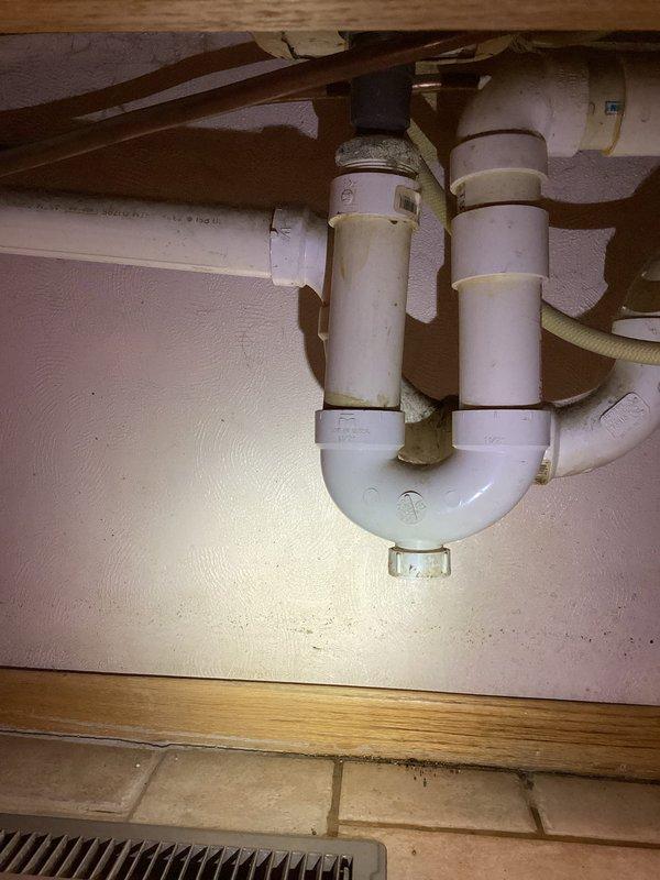 Diagnosed and identified water leak originating from the pop-up assembly underneath bathroom sink. Inspection revealed aging faucets in both downstairs and upstairs lavatory with operational issues in the upstairs drain assembly. Recommended and scheduled replacement of both lavatory faucets, with installation to be completed on Thursday.