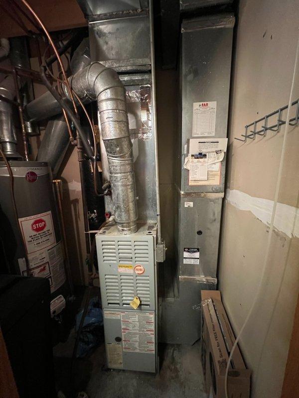 Diagnosed R22 system from 1997 with no cooling issue due to significant ice buildup on evaporator coil and refrigerant line. Performed R22 recharge to restore temporary cooling function. Identified aging system (25+ years) with deteriorating components; scheduled comprehensive system replacement estimate for Thursday morning.