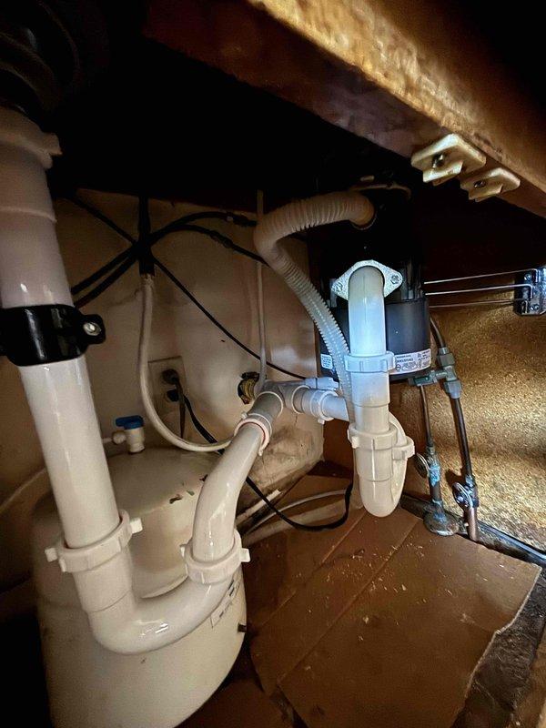 Responded to service call for non-functioning garbage disposal. Upon inspection, removed existing unit and installed new garbage disposal model. Connected all plumbing components, including proper P-trap configuration and drain assembly. Verified system operation and confirmed no leaks in the newly installed components.