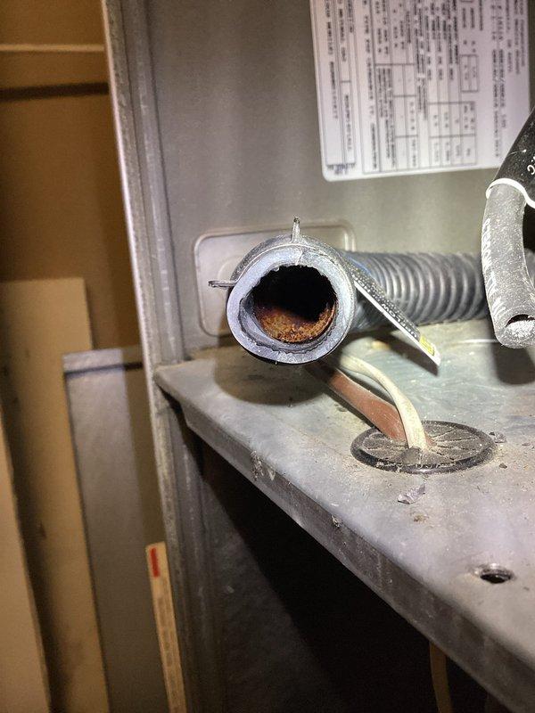 Completed diagnostic assessment on 23-year-old Carrier WeatherMaker 9200 gas furnace. Found plugged condensate trap that likely caused short cycling, explaining customer's increased energy consumption last winter. Inspection revealed significant deterioration of the secondary heat exchanger with multiple holes, confirming need for replacement. Tagged unit as unsafe and arranged for sales consultant to provide replacement options tomorrow.