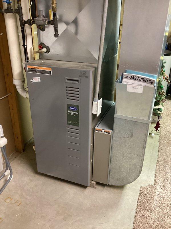 Completed diagnostic assessment on 23-year-old Carrier WeatherMaker 9200 gas furnace. Found plugged condensate trap that likely caused short cycling, explaining customer's increased energy consumption last winter. Inspection revealed significant deterioration of the secondary heat exchanger with multiple holes, confirming need for replacement. Tagged unit as unsafe and arranged for sales consultant to provide replacement options tomorrow.