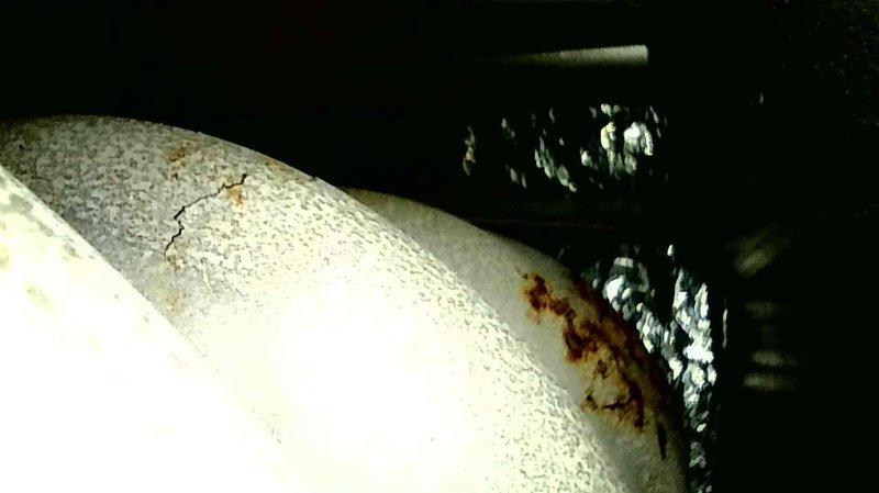 Performed heating safety inspection on Ruud furnace in response to first call regarding possible cracked combustion chamber and yellow/orange flames. Diagnostic assessment revealed significantly rusted heat exchanger with visible cracks and deterioration, confirming unsafe operating condition. Provided customer with replacement options and estimate for new unit installation.