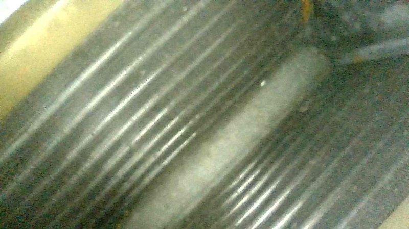 Performed standard maintenance on 2-year-old oil furnace including nozzle replacement, chimney inspection, and heat exchanger inspection. Discovered significant water accumulation in blower compartment, likely due to improperly sloped evaporator coil within the plenum from recent AC installation. Scheduled follow-up with installation supervisor to assess corrective measures needed.