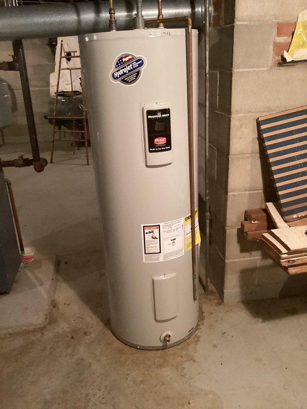 Performed annual maintenance on 1996 Weil-McLain model Heii4 LP boiler. Removed burners for cleaning, vacuumed combustion chamber, and verified proper operation. Tested igniter (80 ohms reading within acceptable range) which is currently functioning adequately despite customer concerns. Left estimate for replacement igniter as preventative option, though current component remains serviceable. Noted system is in good condition despite age.
