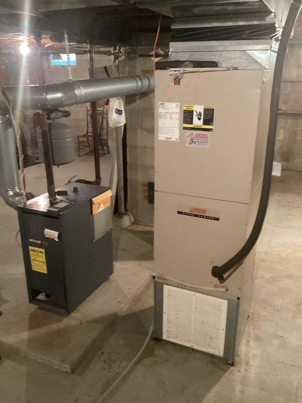 Performed annual maintenance on 1996 Weil-McLain model Heii4 LP boiler. Removed burners for cleaning, vacuumed combustion chamber, and verified proper operation. Tested igniter (80 ohms reading within acceptable range) which is currently functioning adequately despite customer concerns. Left estimate for replacement igniter as preventative option, though current component remains serviceable. Noted system is in good condition despite age.