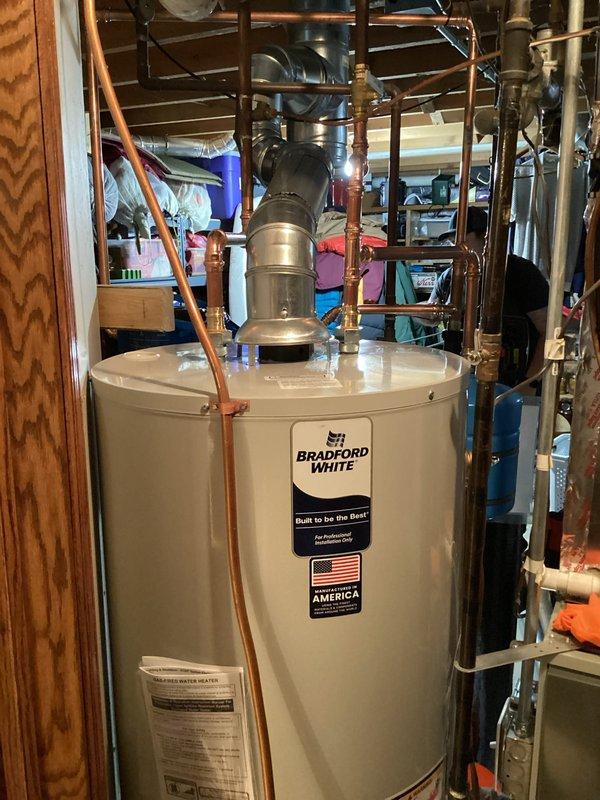 Successfully installed a new 50-gallon Bradford White atmospheric water heater to replace the customer's existing unit. Completed all necessary piping connections, including proper venting and water supply lines, and confirmed the system is functioning correctly with no leaks.
