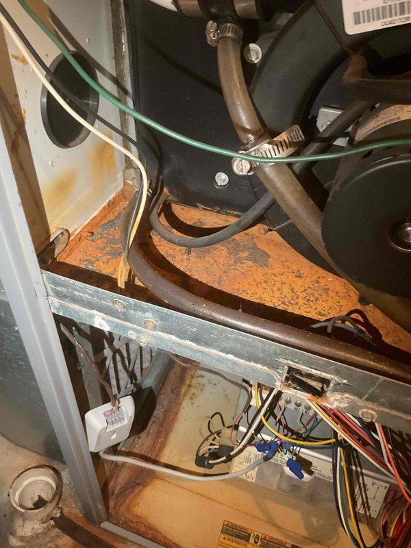 Performed routine furnace and AC tune-up service as requested. Upon inspection, discovered cracked heat exchanger in furnace and high carbon monoxide levels, resulting in red-tag designation for safety concerns. Recommended complete furnace replacement due to age (2008 model) and critical safety issues identified.