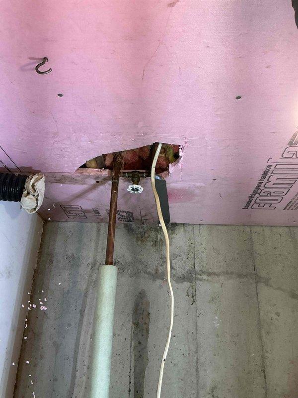 Addressed a water leak at copper joint above the pressure tank on the main water line to the residence. Water supply to home had been shut off prior to arrival. Successfully remediated the issue by re-piping a section of copper plumbing above the pressure tank, restoring water service to the property.