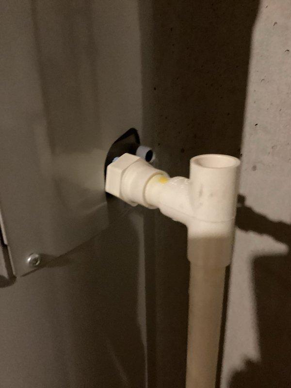 Responded to service call for Bradford White heat pump water heater displaying F20 error code. Diagnosed issue as clogged condensation pipe, which was removed, cleared of blockage, and drained of accumulated water. After thoroughly blowing out the obstruction in the pipe, reinstalled condensate line and verified proper system operation.