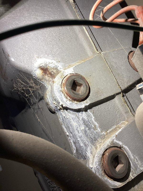 Conducted diagnostic inspection on boiler showing signs of compromise. Identified a pinhole leak in the aluminum casting causing minor water seepage. Corrosion visible around fasteners and mounting points. Scheduled follow-up consultation for complete boiler replacement options.