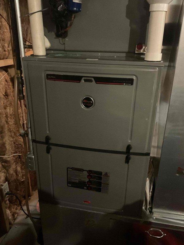 Performed routine tune-up on 14-year-old Ruud furnace system which was operational upon arrival. Diagnosed non-responsive Honeywell thermostats on second and third levels; discovered disconnected red wire and restored connectivity. Main level thermostat (newer Honeywell with color display) was functioning properly. System now operating correctly with balanced temperature control across all zones.