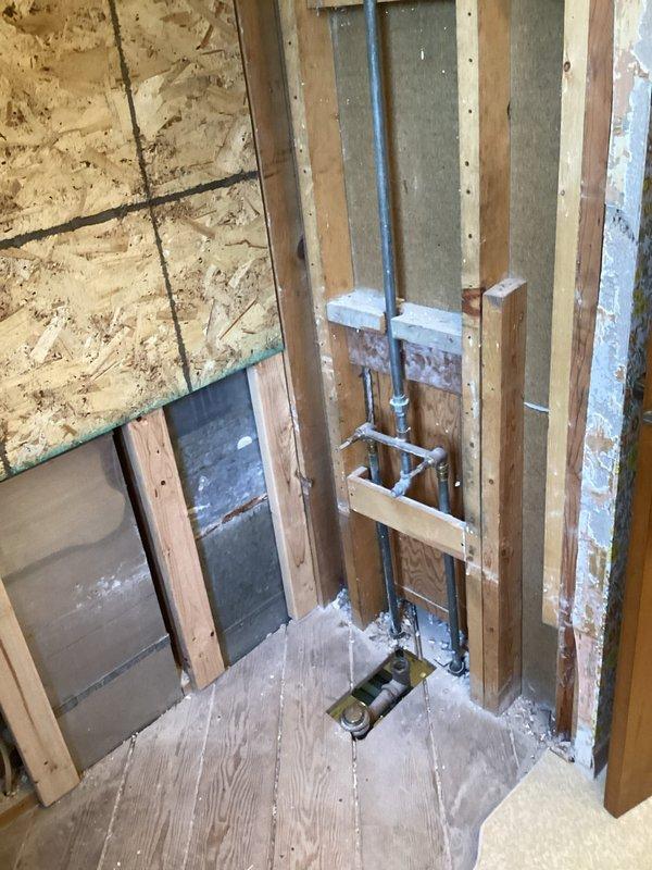 Successfully installed customer-supplied shower valve and drain as part of a coordinated renovation with Tundraland. Accessed plumbing through exposed wall framing, properly connected all supply lines and drainage components to ensure proper water flow and drainage for the new shower installation.