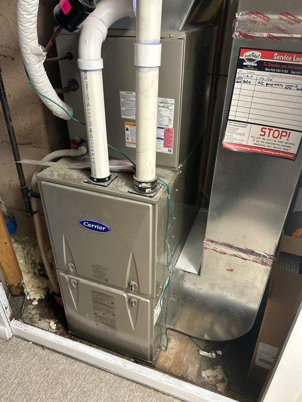 Performed scheduled furnace maintenance on Carrier residential furnace system. Unit is operational with no immediate concerns. Noted presence of rust/corrosion on interior compartment floor that should be monitored during future service visits.