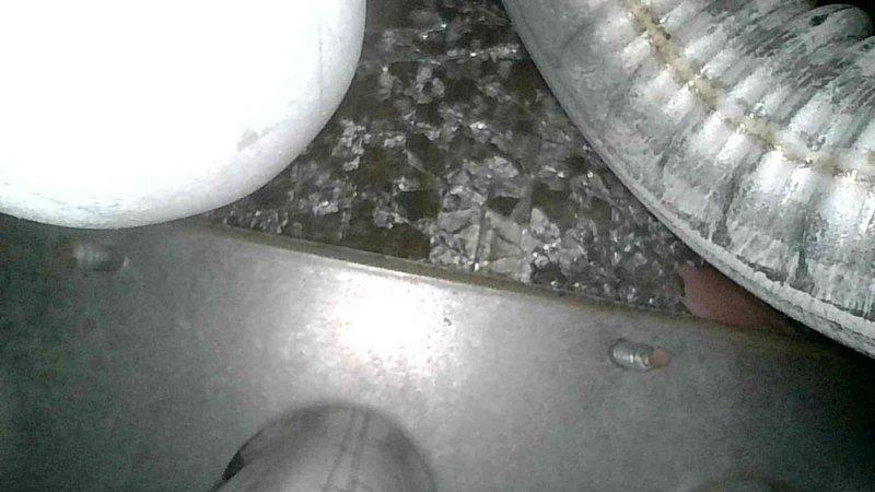 Responded to no heat complaint with diagnostic testing revealing pressure switch code on Goodman furnace. Discovered inoperable inducer motor receiving no power from control board, compromised heat exchanger seal with visible hole, and blower motor leaking oil with excessive dust accumulation. System was tagged out as unsafe to operate and replacement options were presented to customer including new heat exchanger, blower motor, and control board.