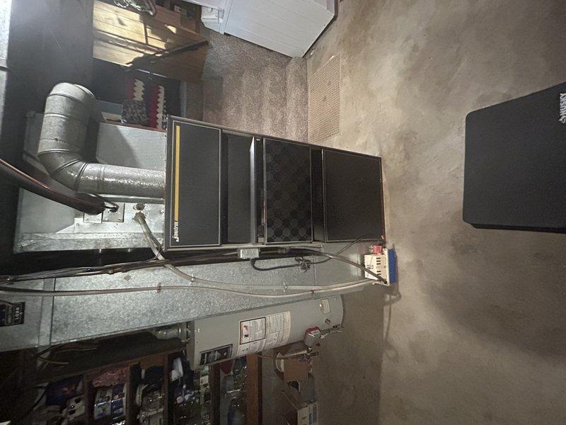 Performed routine LP furnace tuneup on 1972 Janitrol unit. Inspected heat exchanger, noting possible minor crack on rear section that couldn't be fully verified; recommended annual inspections if replacement is deferred. Identified loose blower belt (4L-450) requiring replacement. Service advisor scheduled for follow-up visit to provide furnace replacement quote and discuss requested air vent cleaning services.